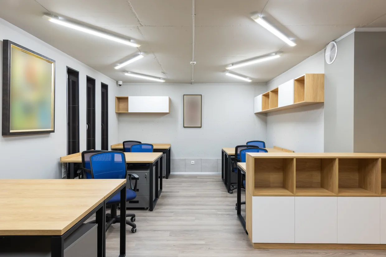 Office interior lit by linear LED fittings