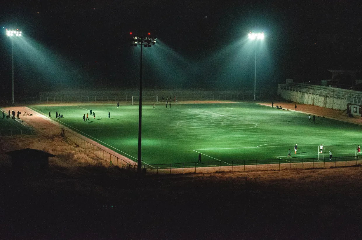 Sports field under floodlights at night